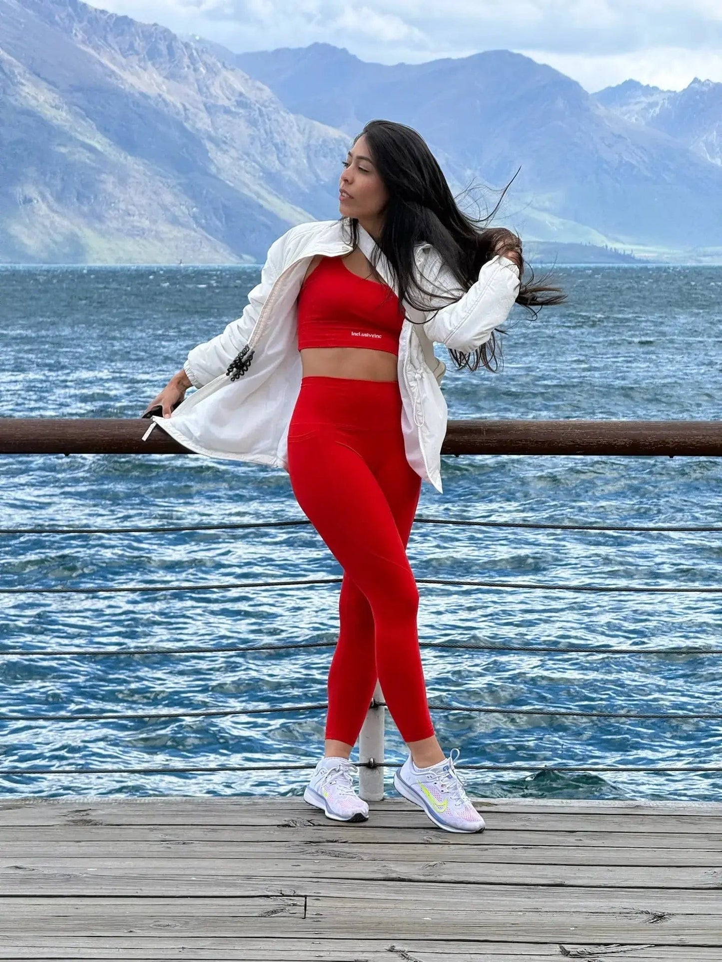 Premium Active Red Gym Leggings with Pockets by Incl.usiveinc, featuring a high waist fit and stretchy fabric, perfect for workouts and everyday wear.