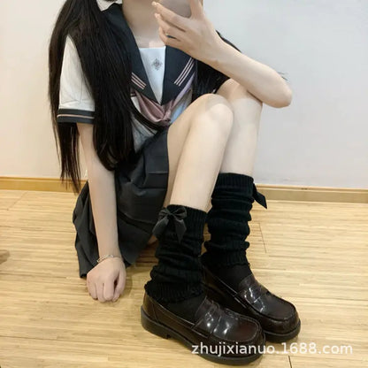 Dazzling Dreams Studio luxury women's lace bow loose socks styled on a chic backdrop, highlighting their thigh-high coverage and fashionable design.