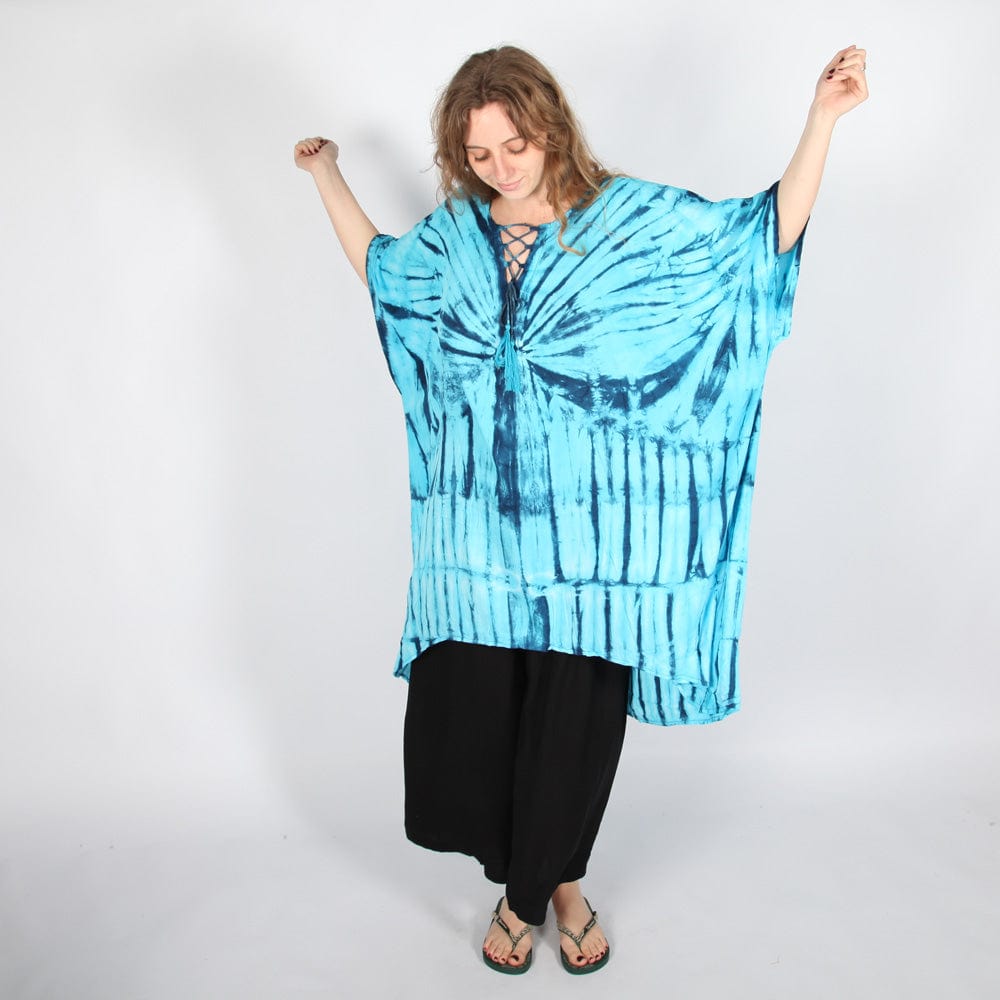 Luxurious plus size tie dye poncho kurta top draping elegantly, perfect for layering over jeans or shorts during holiday outings.