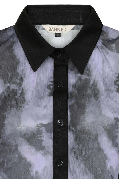 Close-up view of the Banned Apparel Selene Mesh Blouse, highlighting the luxurious texture and intricate details of 100% polyester woven fabric