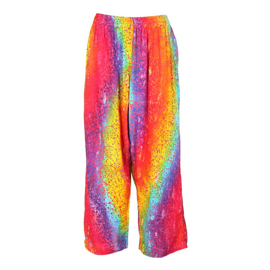 Handmade rainbow swirl batik trousers featuring multicoloured plant-inspired print, designed for a luxurious fit, perfect for UK sizes 8-16.