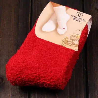 Chic Women's Bed Socks in vibrant red, featuring a luxurious fluffy design for ultimate coziness on cold nights.