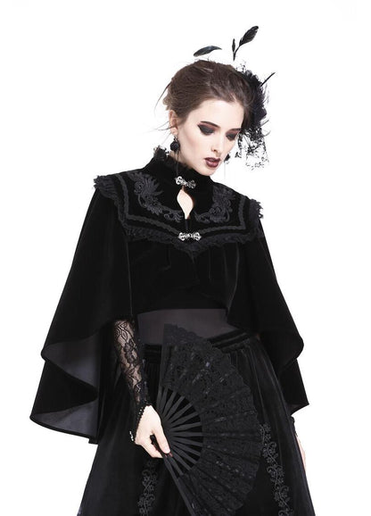 Dramatic back view of the Dark In Love Velvet Lark Capelet, featuring elegant lace details and a sumptuous black hue, ideal for gothic chic styling.