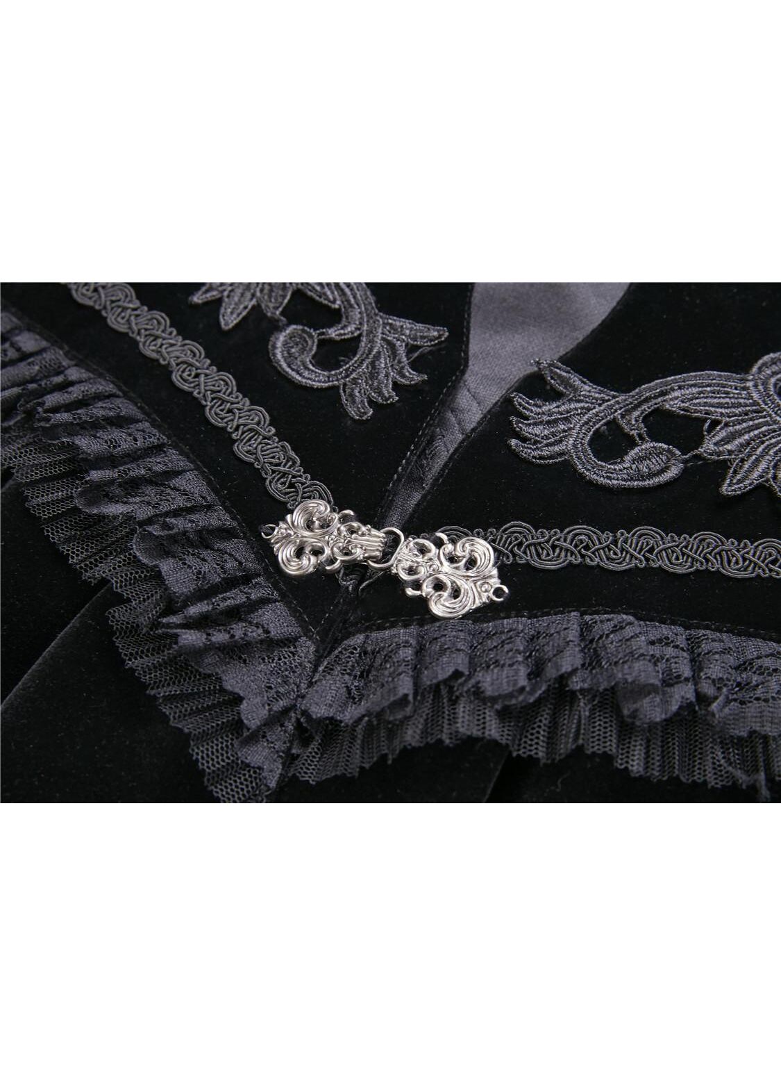 Dramatic view of the Dark In Love velvet Lark capelet with ornate clasp fastenings, emphasizing its exquisite craftsmanship and stylish silhouette.