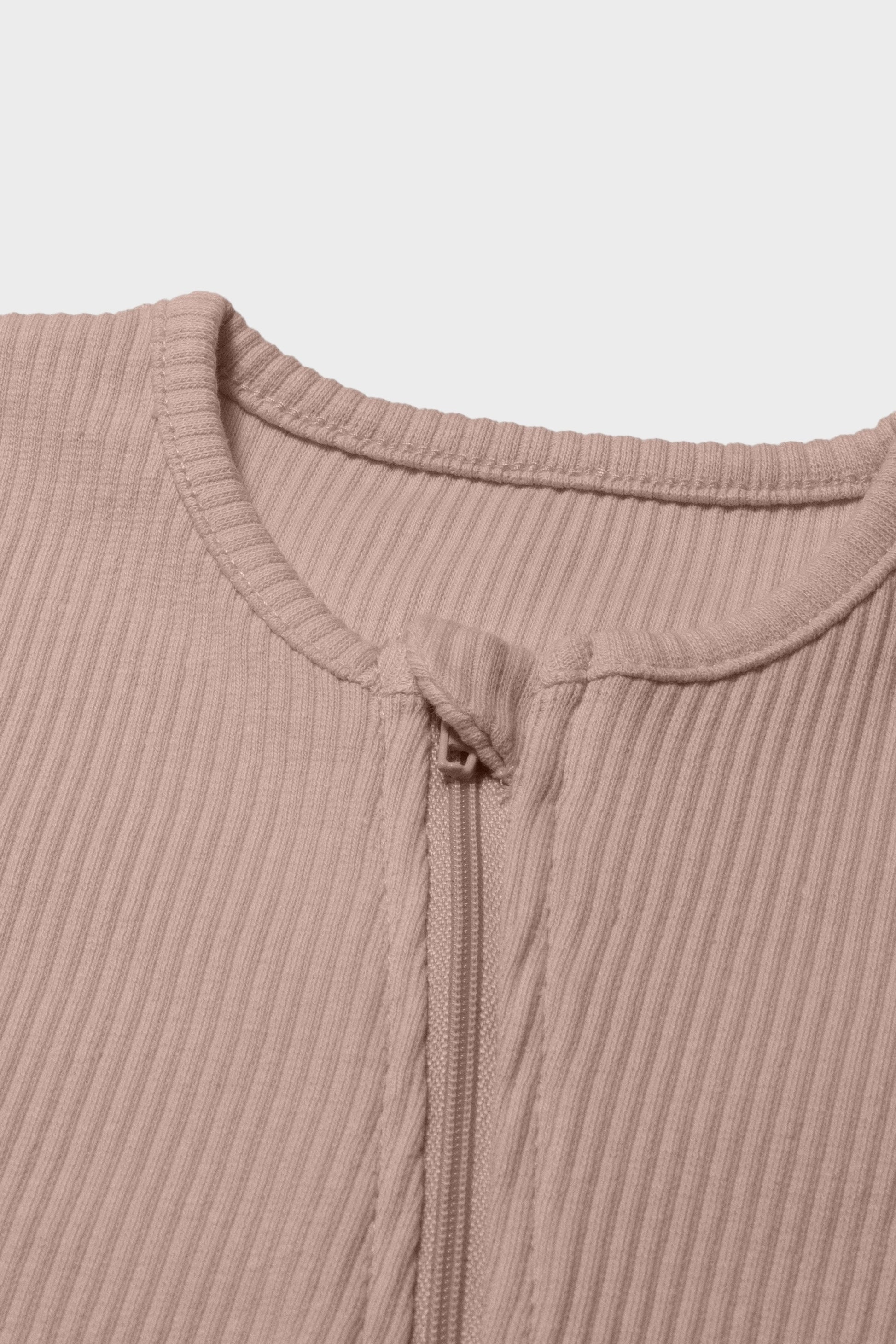 DreamBuy's premium velvet baby sleepsuit in mocha, perfect for sensitive skin, showcasing a stylish and comfortable design.