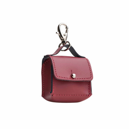 Luxury Oxblood Red Mini Bag Charm handcrafted leather accessory, showcasing exquisite craftsmanship and elegant design, measuring 60 x 60 mm.