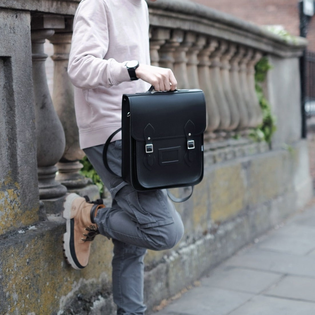 Handmade Leather City Backpack in premium black, featuring stylish adjustable straps and crafted from finest Scottish leather, perfect for laptops and tablets, showcasing luxury and functionality.