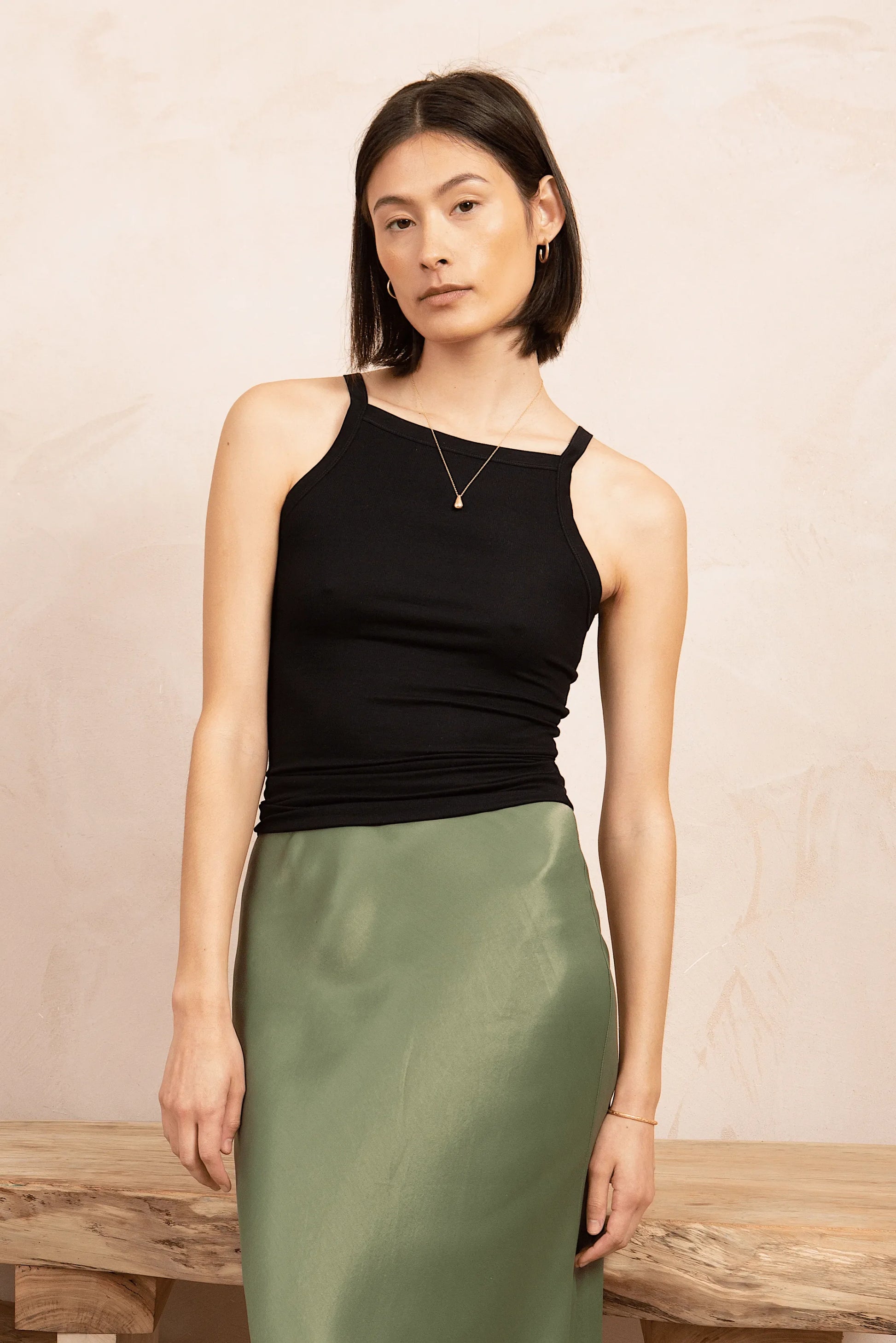 Luxuriously soft Women's High Neck Tank Top made from sustainable TENCEL™ Lyocell, showcasing a stylish ribbed design, perfect for layering in sizes 8-16.