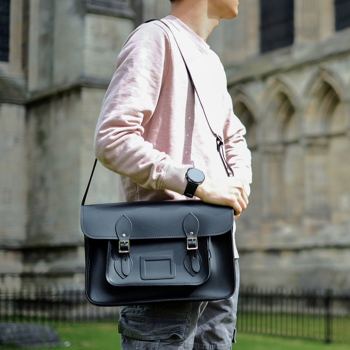 Luxury Handmade Leather Satchel in black, featuring an adjustable strap and personalisation options, showcasing traditional British craftsmanship and elegant design suitable for various occasions.