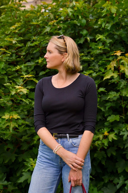 Close-up of a luxurious women's 3/4 sleeve t-shirt, highlighting the soft fabric and refined craftsmanship for a chic wardrobe staple.