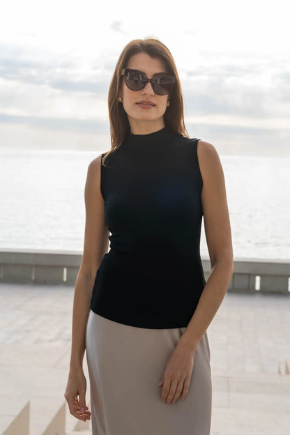 Luxury sleeveless mock neck top in ribbed Micro Modal fabric, showcasing soft and elegant texture, perfect for chic layering.
