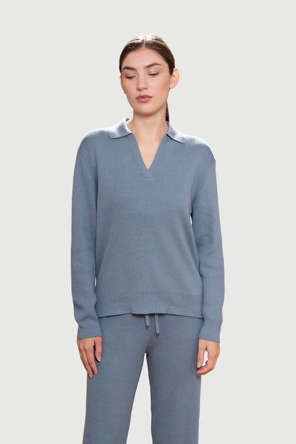 Back view of the ribbed lounge jumper demonstrating its sophisticated dropped shoulder design and full-length sleeves.