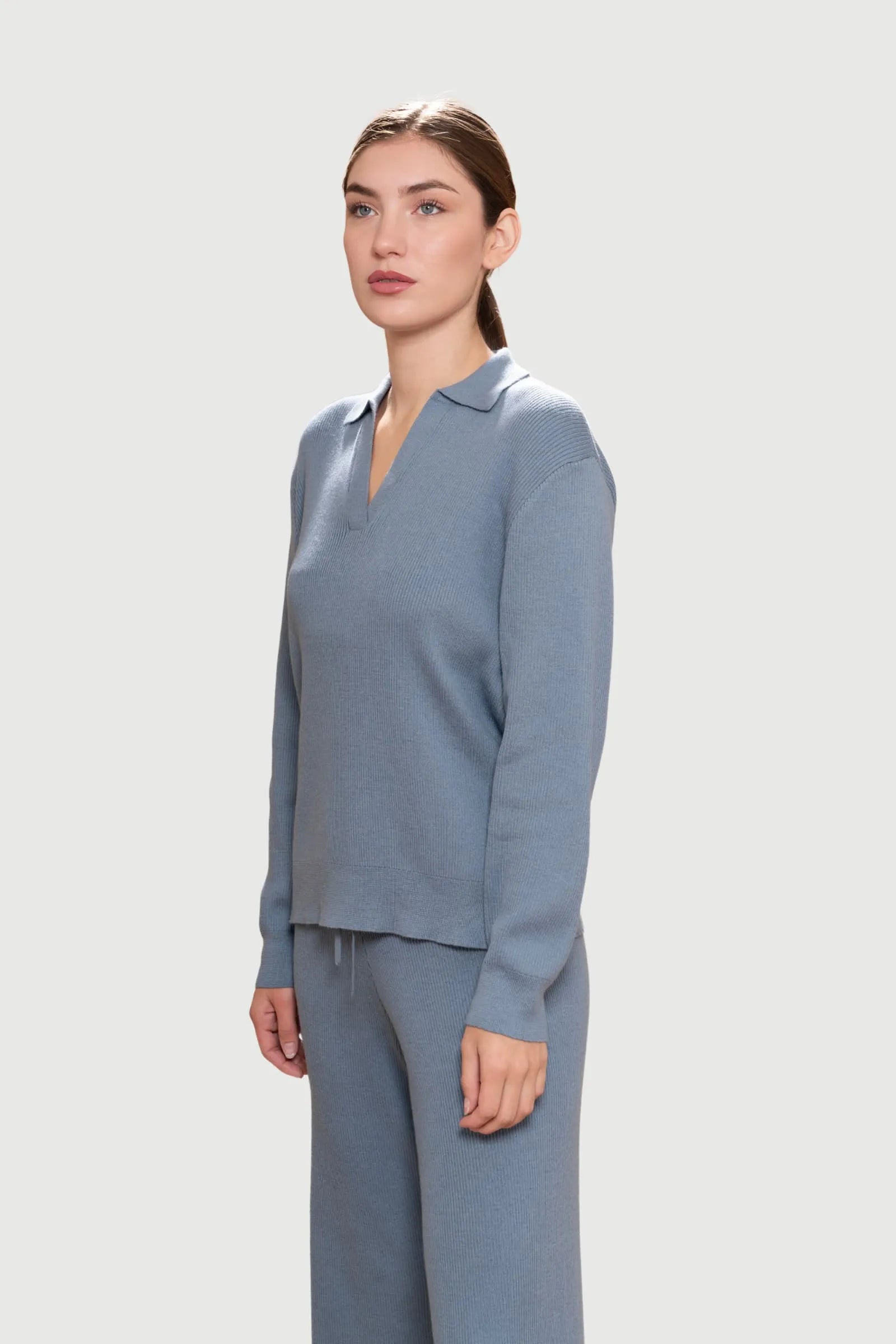 Close-up of the ribbed texture of luxury loungewear trousers made from Pima cotton and baby alpaca, highlighting the exquisite craftsmanship and softness.