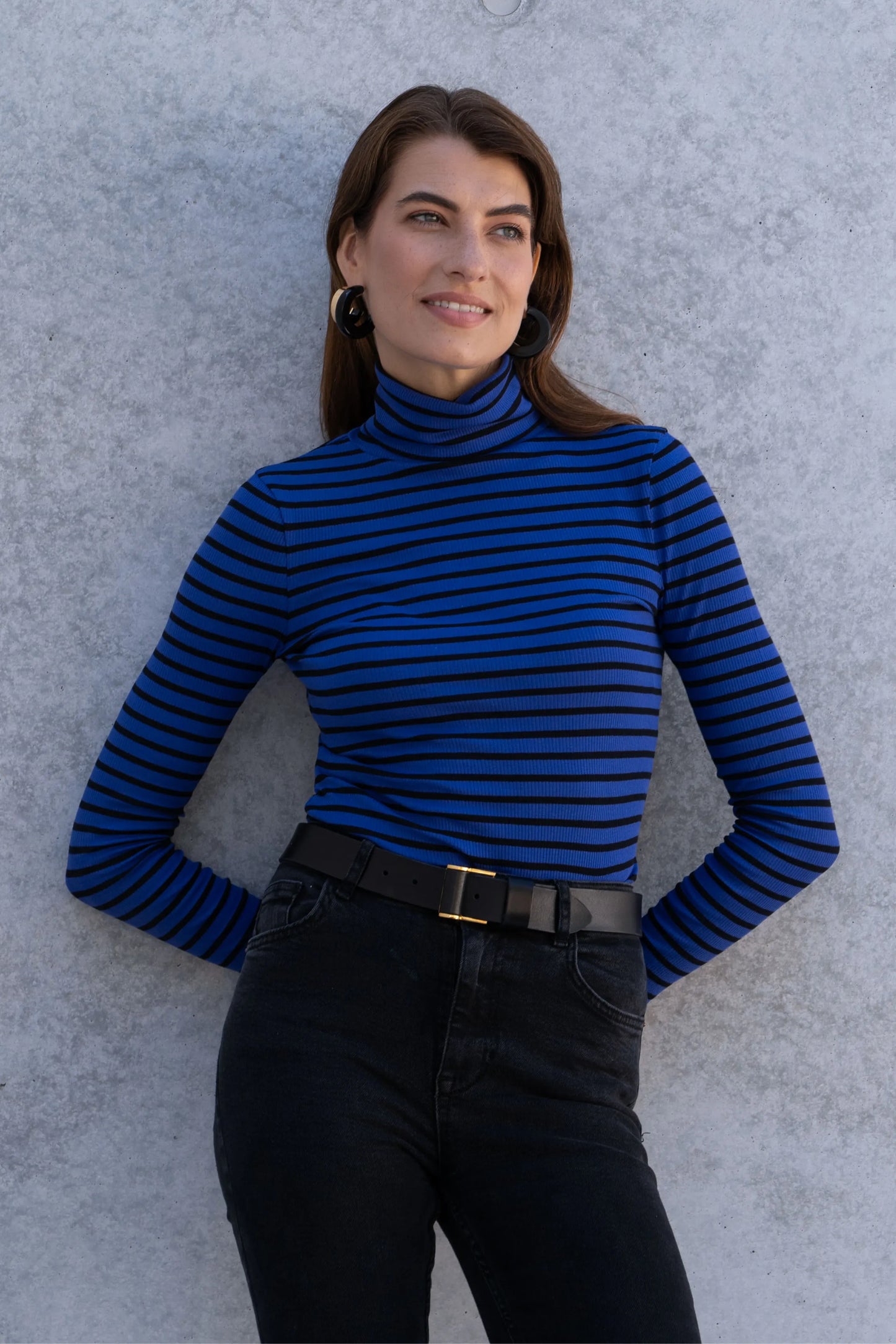 Versatile Women's Striped Cotton Roll Neck Top displayed casually with tailored trousers, ideal for workwear and everyday elegance.