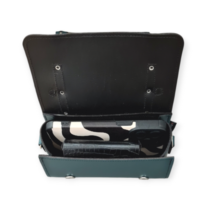 Handcrafted leather bowler bag displayed with detachable adjustable crossbody strap, demonstrating versatility for any occasion.