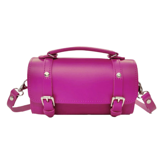 Zatchels Handmade Leather Bowler Bag in vibrant magenta showcasing its elegant compact cylinder design, perfect for modern luxury enthusiasts.