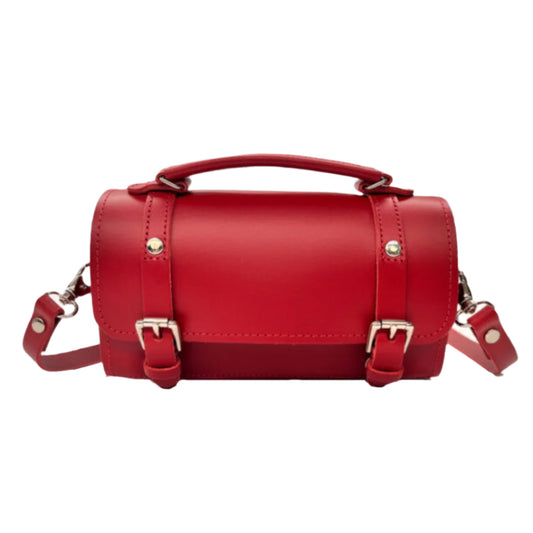 Zatchels Handmade Leather Bowler Bag in striking red, showcasing its compact design with top handle and adjustable crossbody strap, perfect for stylish everyday use.