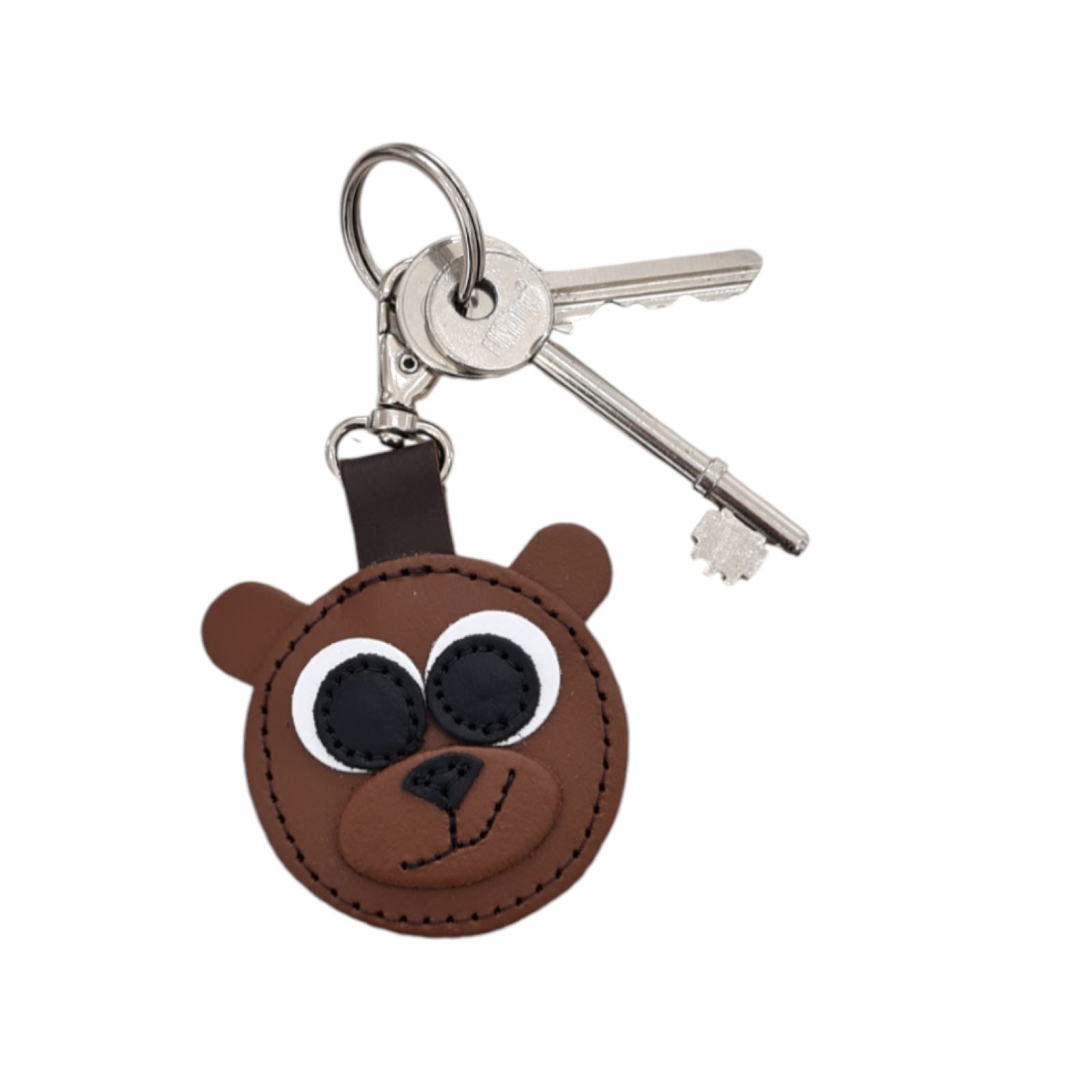 Stylish brown bear leather charm effortlessly clipped onto a handbag, illustrating its versatility and artisanal elegance.