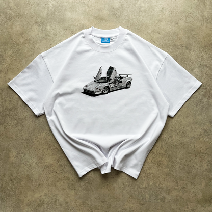 Lifestyle shot of FROST's Chalk White Countach Tee styled with modern streetwear, highlighting its versatility and contemporary silhouette.