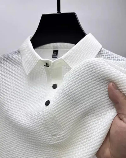 Refined white men's polo shirt with a chic textured finish, designed for a classy yet casual vibe, perfect for any occasion.