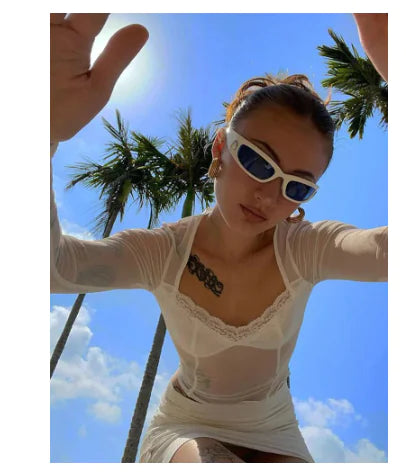 Luxurious Beige Women's Designer Crop Top Tee by Dazzling Dreams Studio, showcasing 90s fashion with a soft fabric and relaxed fit, perfect for chic casual styling.