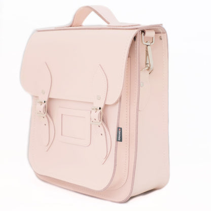 Close-up of the luxurious Cherry Blossom Leather texture on the City Backpack, featuring durable silver nickel buckles and matching stitching for a sophisticated look.