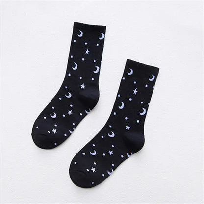 Dazzling Dreams Women’s/Girl’s Street Sports Socks in elegant black adorned with subtle light blue stars and moons, offering a fashionable urban aesthetic.