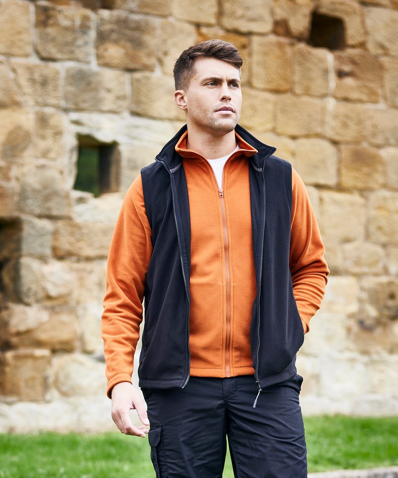 Luxurious recycled polyester core insulation fleece vest in elegant design, showcasing eco-friendly craftsmanship with a full-length zip.