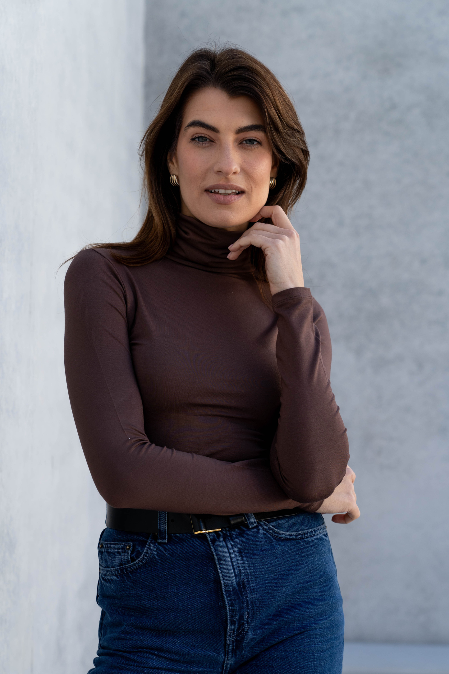 Luxurious Women's Roll Neck TENCEL™ Micro Modal Top in a soft beige hue, showcasing its elegant design and breathable fabric.