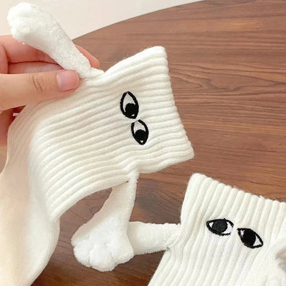 Close-up of Novelty Romantic Magnetic Holding Hands Couple Socks showcasing the unique 3D design and magnetic feature, held in hand to highlight the whimsical details.