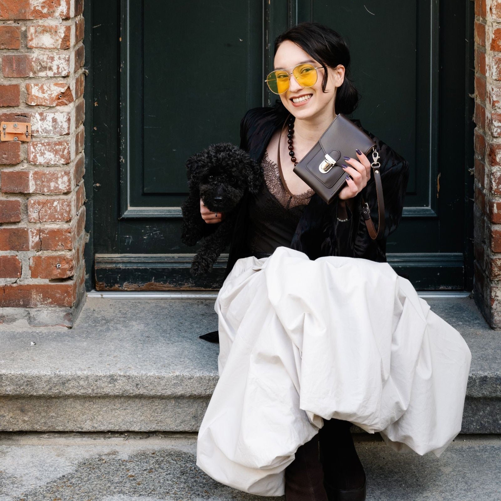 Close-up view of the exquisite texture of the dark brown leather on the Zatchels crossbody phone case, showcasing its premium quality and craftsmanship.