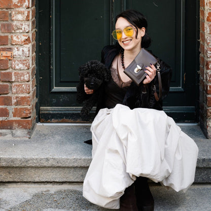 Close-up view of the exquisite texture of the dark brown leather on the Zatchels crossbody phone case, showcasing its premium quality and craftsmanship.