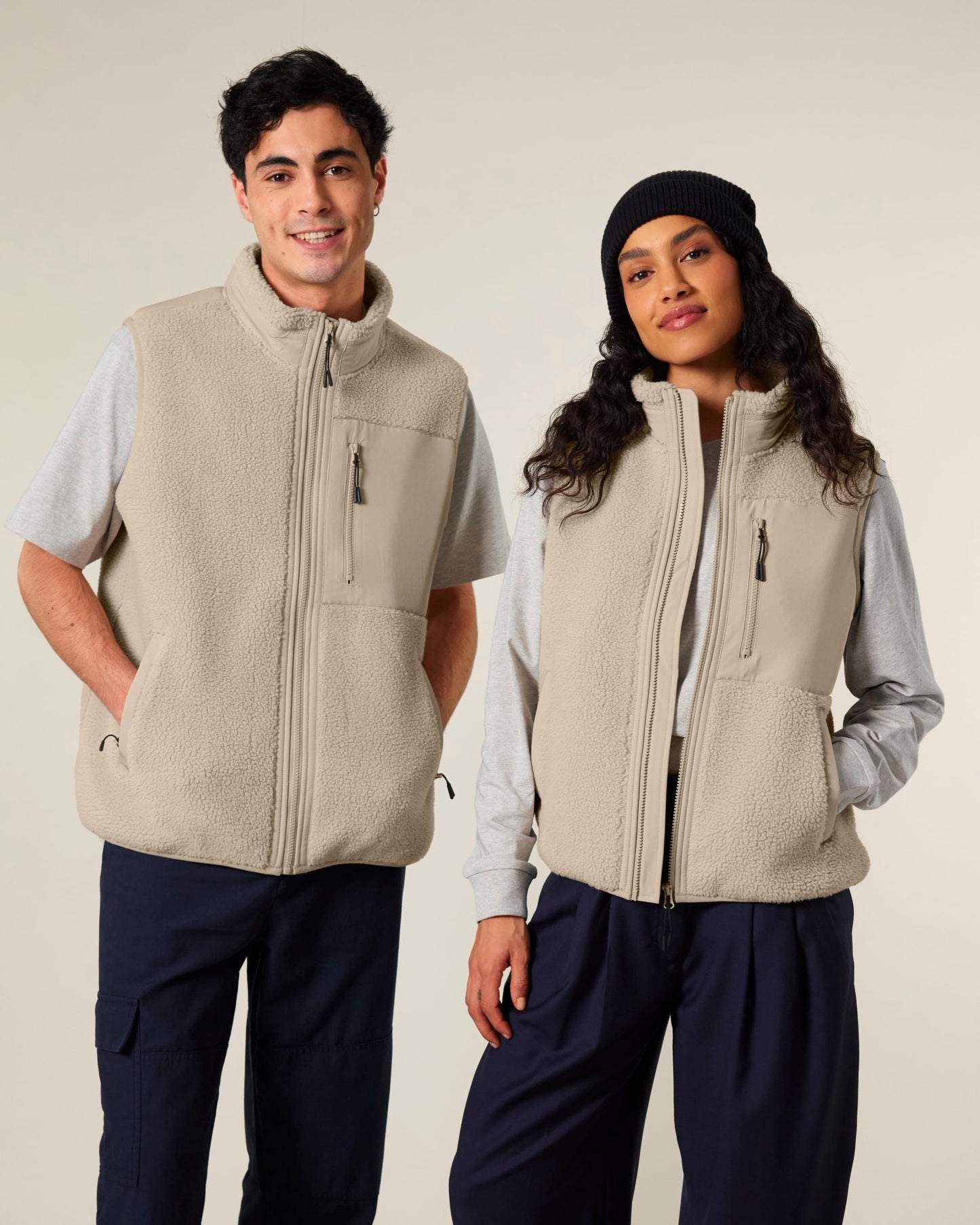 Luxurious unisex recycled sherpa fleece bodywarmer in a stunning outdoor setting, showcasing eco-friendly warmth for all adventures.