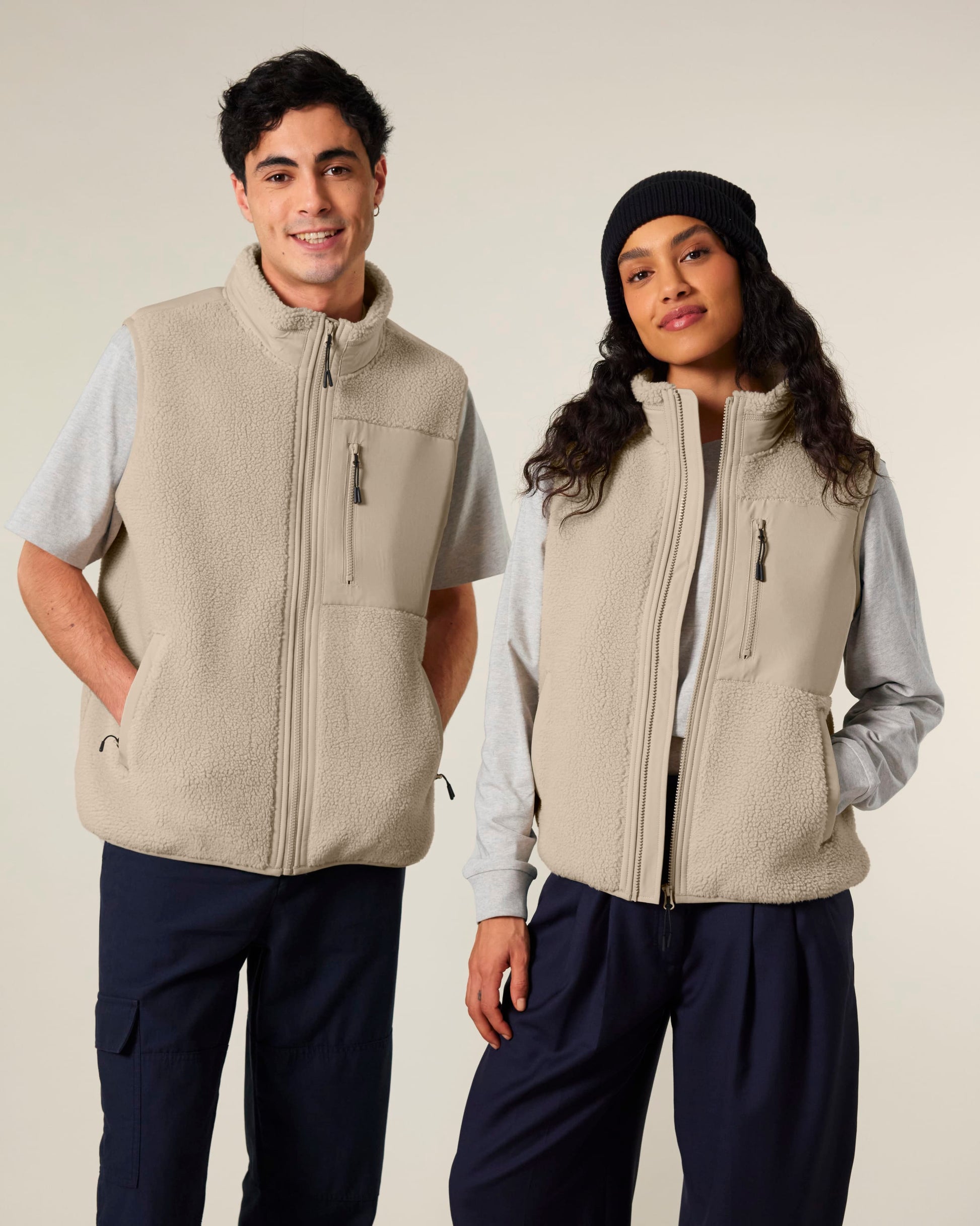 Luxurious unisex recycled sherpa fleece bodywarmer in a stunning outdoor setting, showcasing eco-friendly warmth for all adventures.