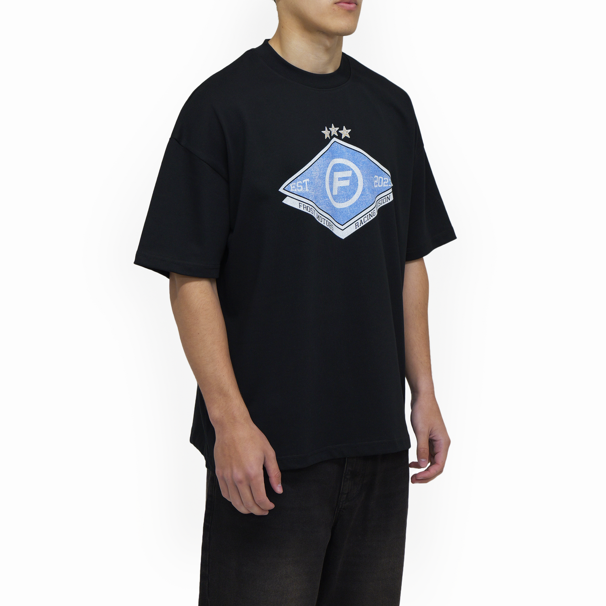 Lifestyle image featuring the FROST Racing Division Tee worn casually, illustrating its dropped shoulders and oversized fit, perfect for style enthusiasts and motorsport fans.
