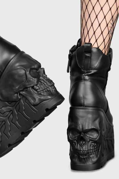 Elegant Killstar Doom Skull Platform Boots showcasing intricate skull detailing and smooth black PU upper, perfect for gothic fashion enthusiasts.