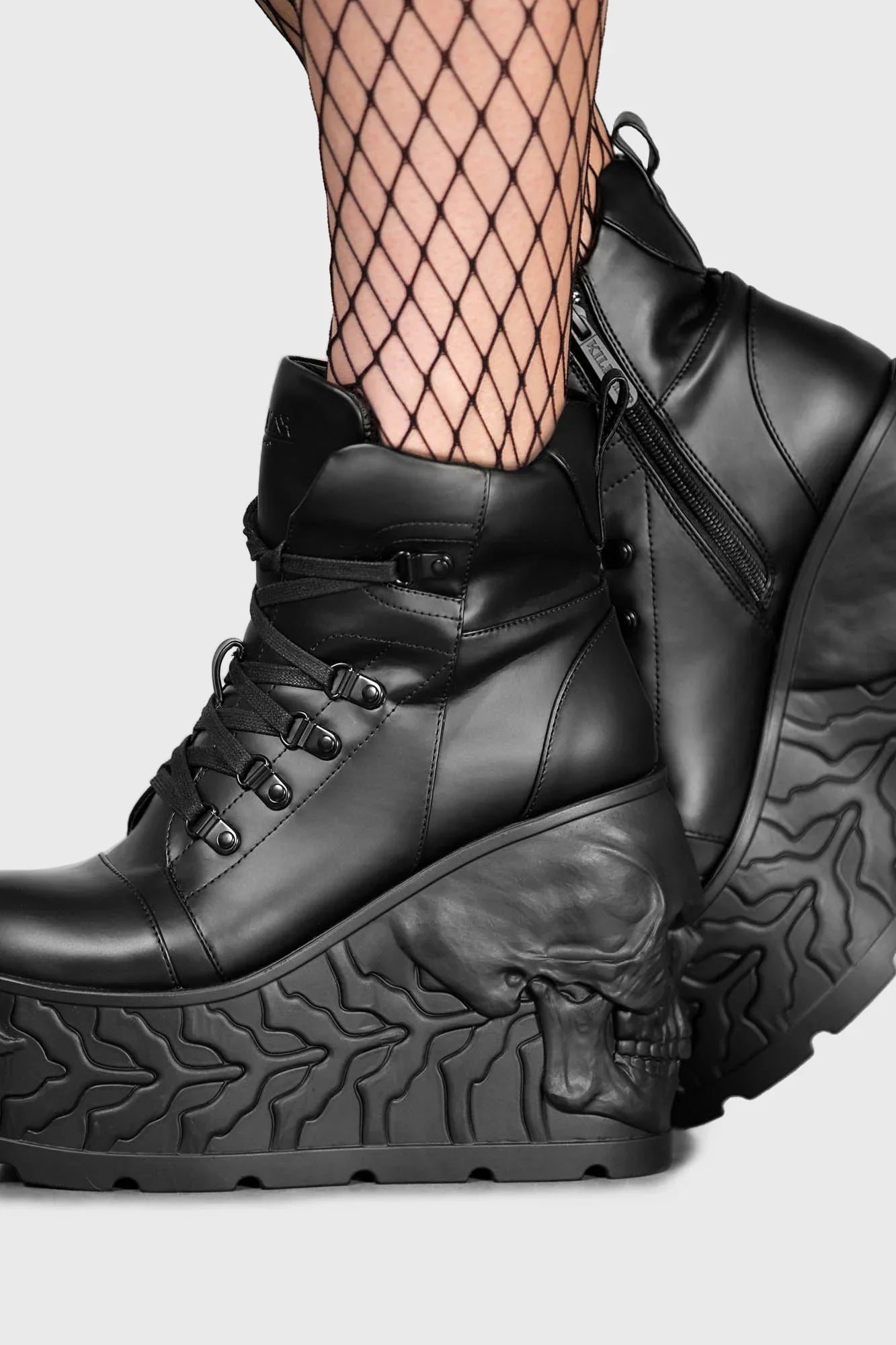 Stylish lace-up front with inner zip on Killstar Doom Skull Platform Boots, designed for easy wear and dramatic flair.
