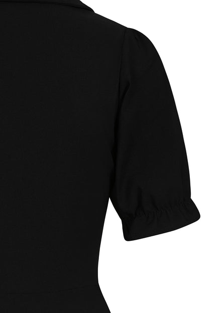 The Elysia Dress styled with chunky boots against a dark urban backdrop, showcasing its versatility for fashionable alternative occasions.