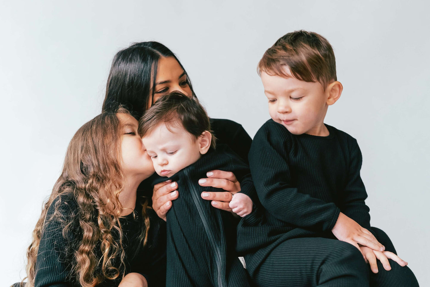 Luxurious soft ribbed fabric of DreamBuy's black matching family pyjamas, designed for ultimate comfort and style, featuring a minimalistic long-sleeved top and drawstring pants.