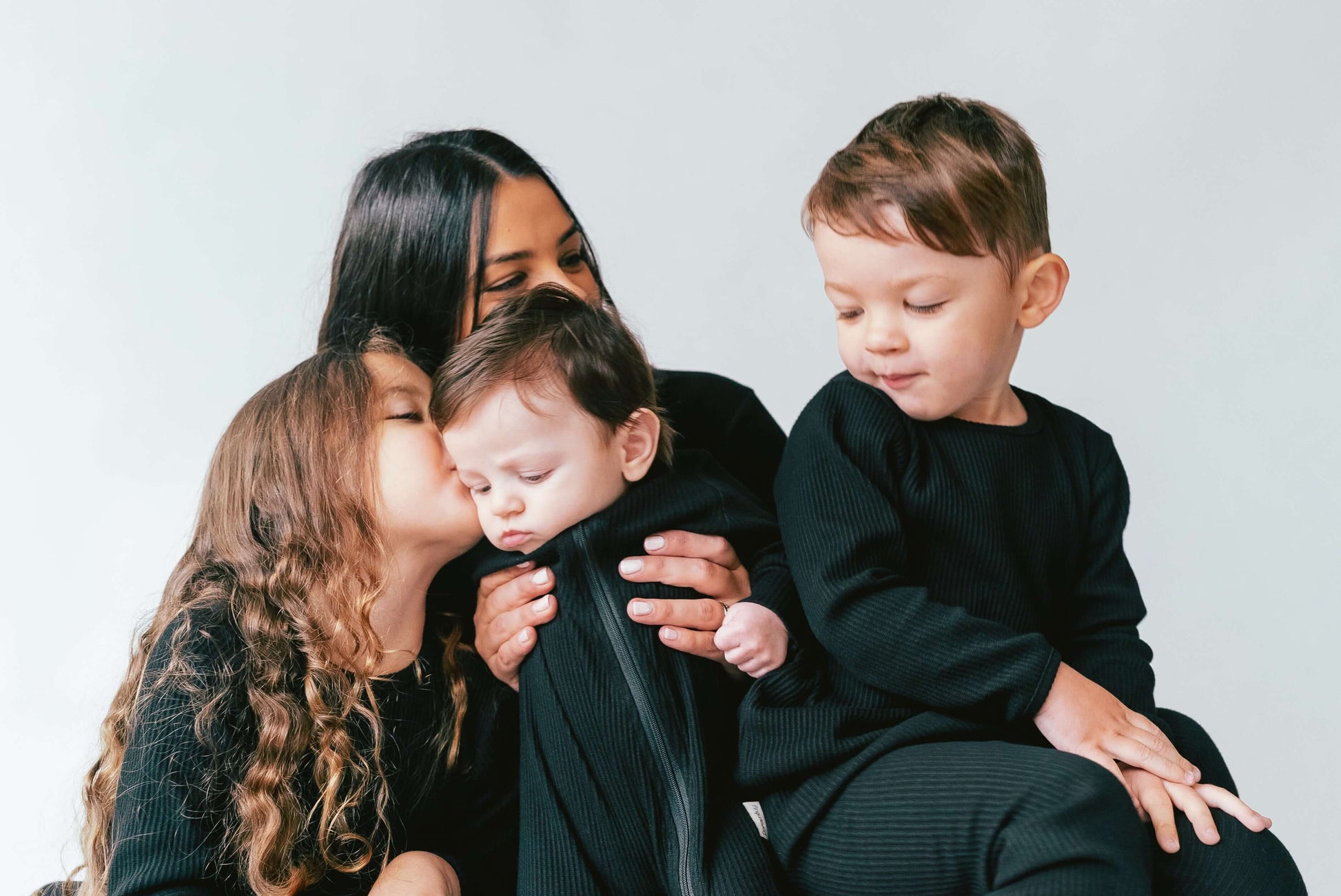 Luxurious soft ribbed fabric of DreamBuy's black matching family pyjamas, designed for ultimate comfort and style, featuring a minimalistic long-sleeved top and drawstring pants.