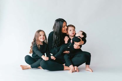 DreamBuy's versatile black matching pyjamas for family play and sleep, combining elegance with fun, making it an excellent choice for festive celebrations and family photos.
