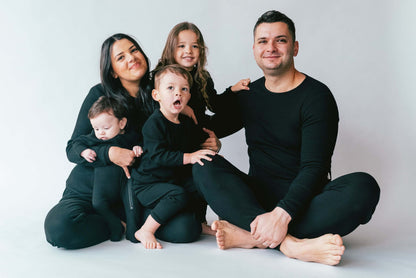 Elegant black matching family pyjamas from DreamBuy, crafted in soft ribbed fabric, perfect for creating a chic and cozy family look for any occasion.