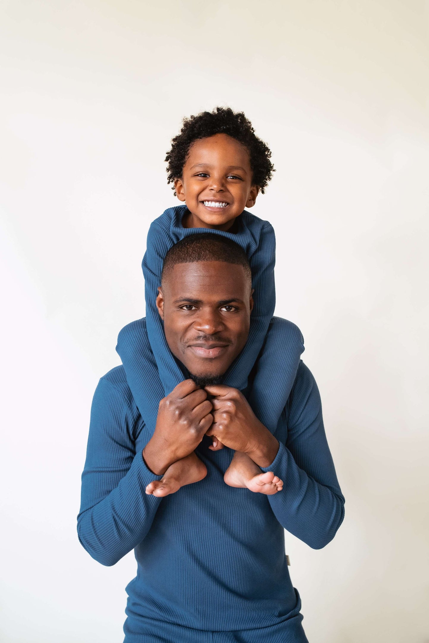 Luxury midnight blue family matching pyjamas set by DreamBuy, featuring ultra-soft cotton fabric, available in sizes from 3 months to XXL, perfect for festive occasions or cozy family lounging.