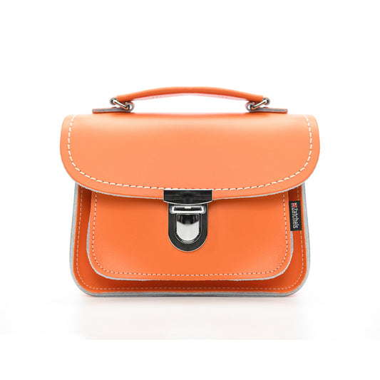 Luna Handmade Leather Bag in vibrant orange, showcasing its elegant design with adjustable strap and chic push lock clasp, perfect for stylish crossbody use.