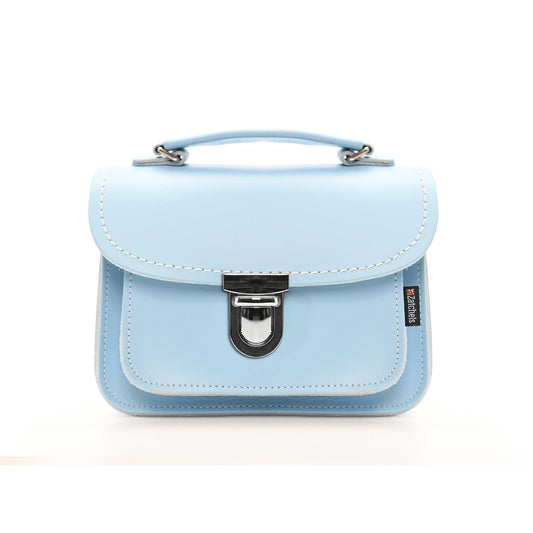 Luna Baby Blue Leather Handbag beautifully crafted in England, showcasing its luxurious design and adjustable strap.