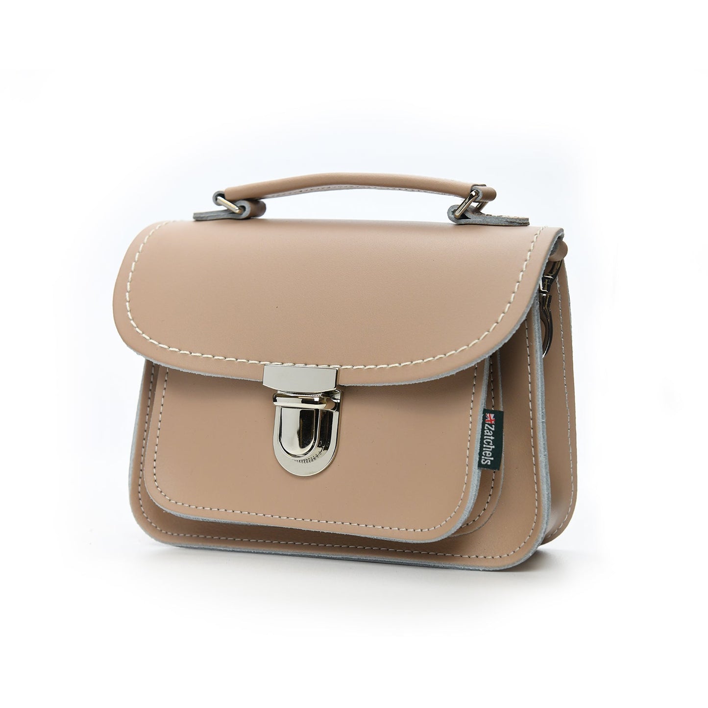 Close-up of the Luna Iced Coffee Leather Bag's secure push lock clasp and fine leather texture, emphasizing its handmade craftsmanship and stylish details.