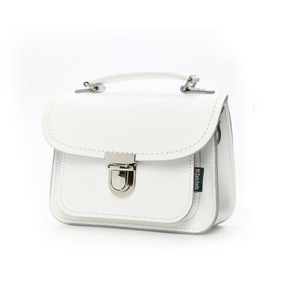 Close-up view of Luna Handmade White Leather Bag's secure push lock clasp, demonstrating luxurious craftsmanship and attention to detail.