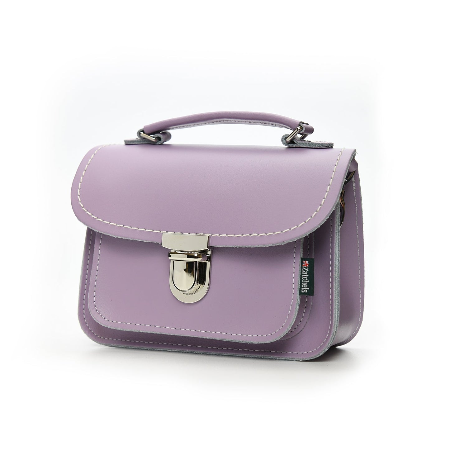 Close-up view of Luna Handmade Pastel Violet Leather Bag featuring soft UK-produced leather, highlighting the secure push lock clasp and stylish top handle.