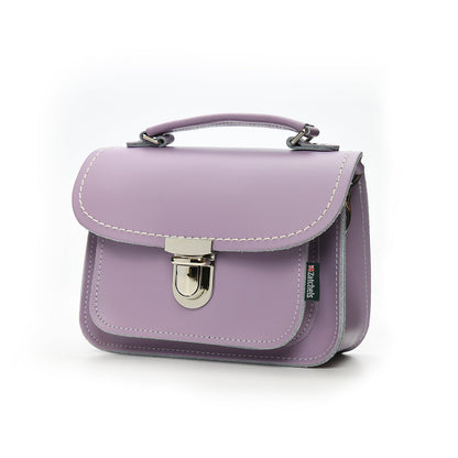 Close-up view of Luna Handmade Pastel Violet Leather Bag featuring soft UK-produced leather, highlighting the secure push lock clasp and stylish top handle.