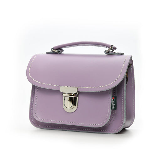 Close-up view of Luna Handmade Pastel Violet Leather Bag featuring soft UK-produced leather, highlighting the secure push lock clasp and stylish top handle.